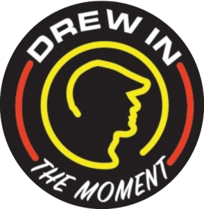 Drew in the Moment – Queen V logo